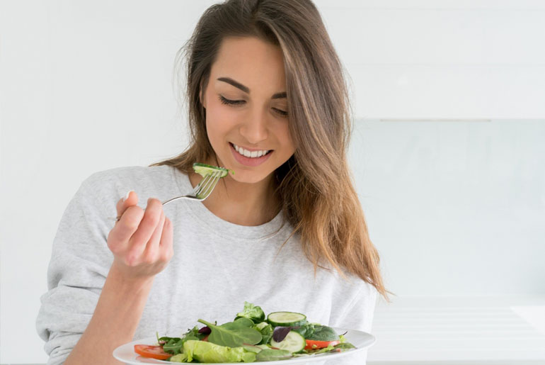 woman eating a salad